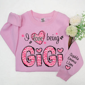 I Love Being Gigi Pink Leopard Heart  - Personalized Sweatshirt With Design On Sleeve - Gift For Grandma, Mom, Wife | Custom Sleeve NH96